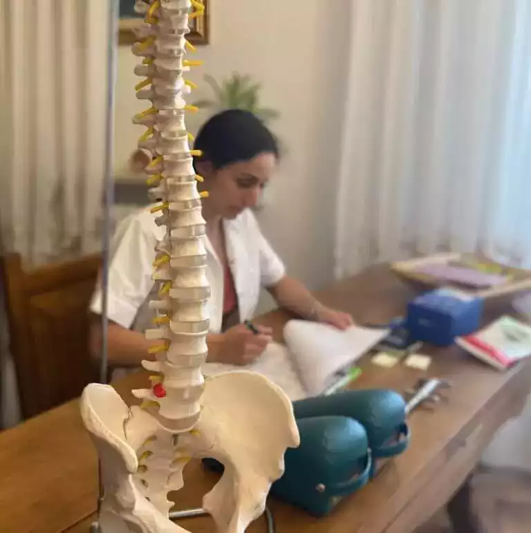 Dr of Chiropractic working on a file